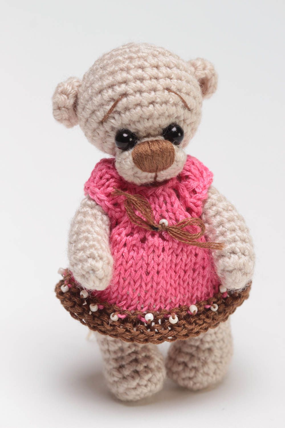 Handmade small soft crocheted toy beige bear girl in pink dress for children photo 2