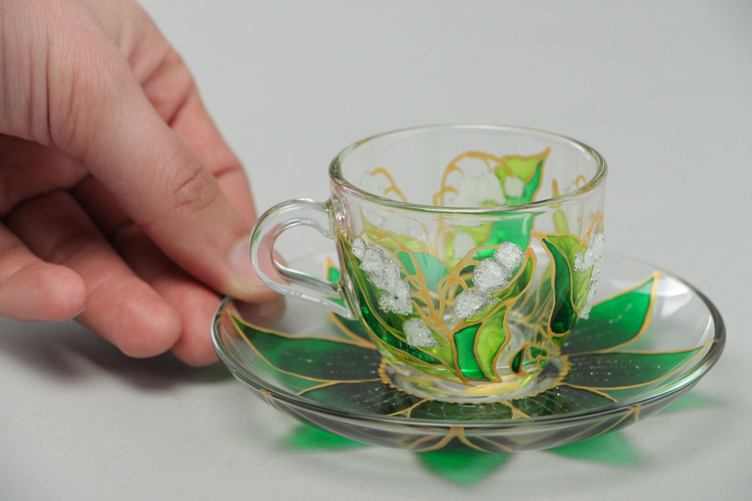 Unique clear glass teacup with hand-painted gold and green floral pattern photo 4