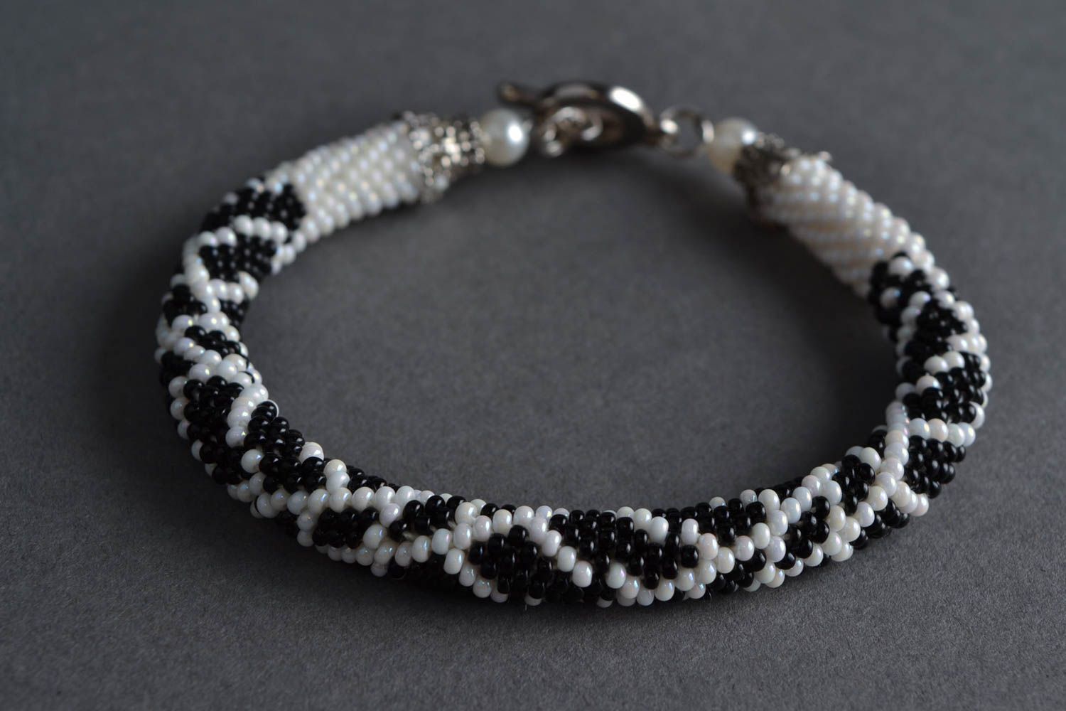 Women's handmade designer woven beaded cord bracelet black and white photo 1