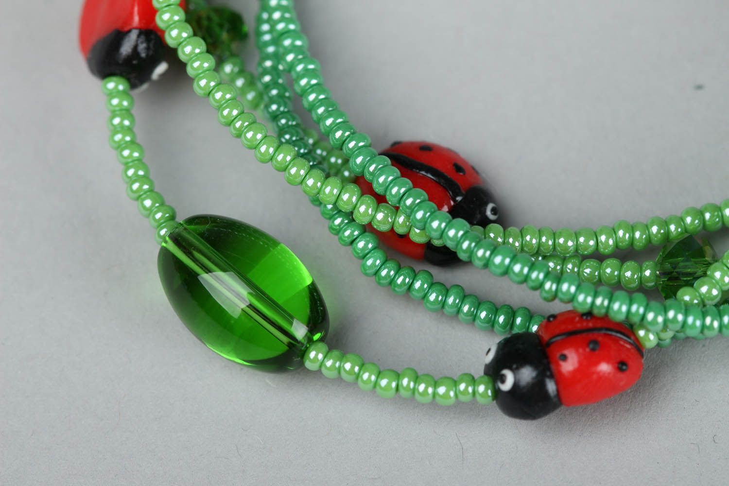 Green bracelet with ladybugs photo 3