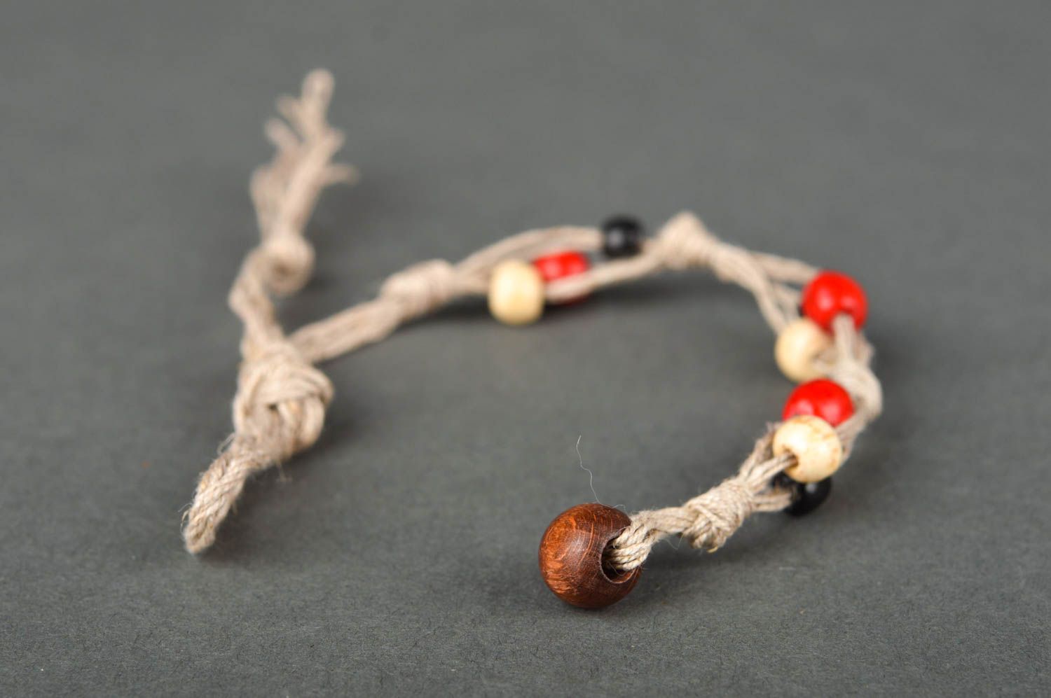 Strand beige rope two-row bracelet with red, black, white, yellow wooden beads for women photo 5