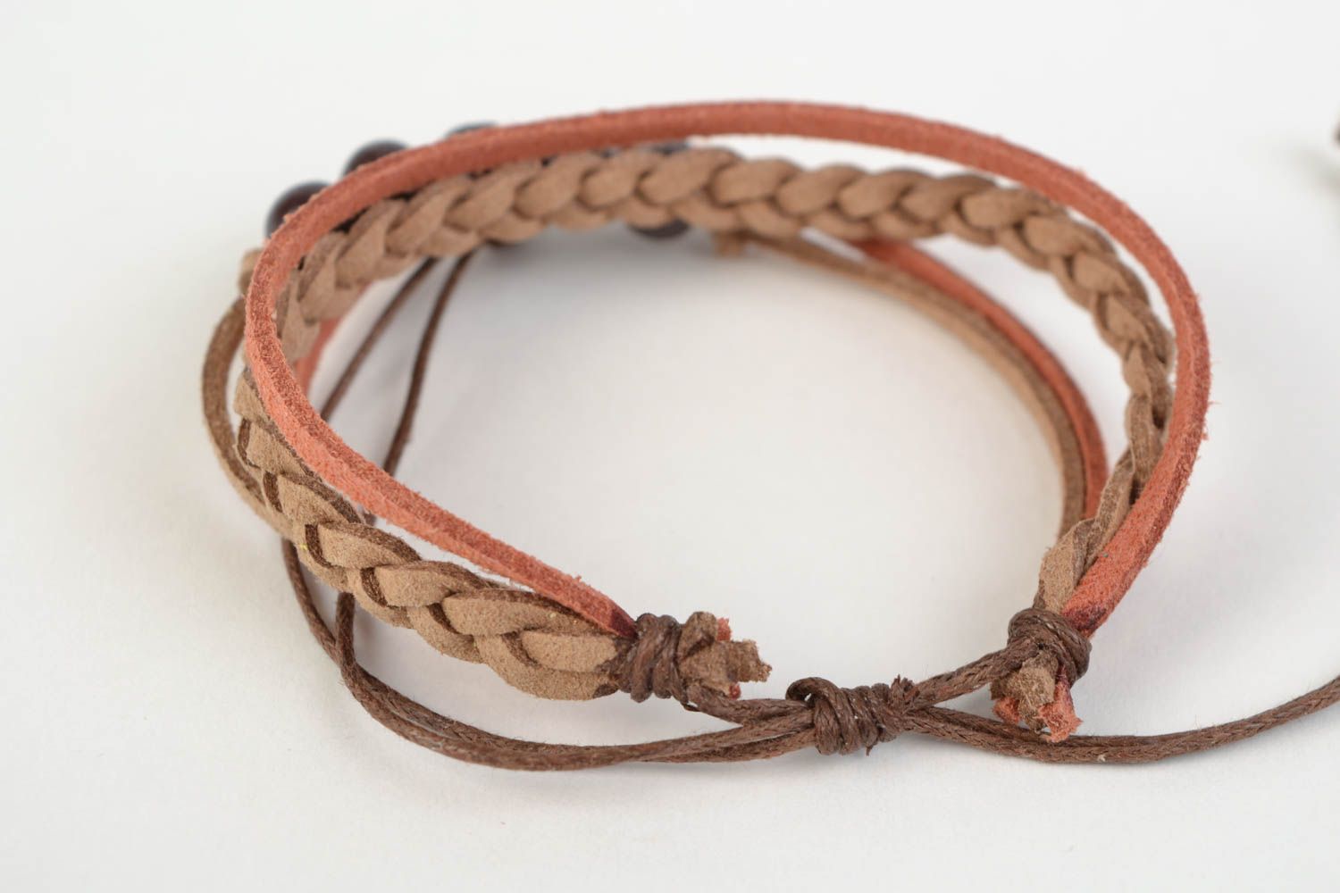 Handcrafted unique bracelet made of chamois-leather with entwined brown beads photo 4