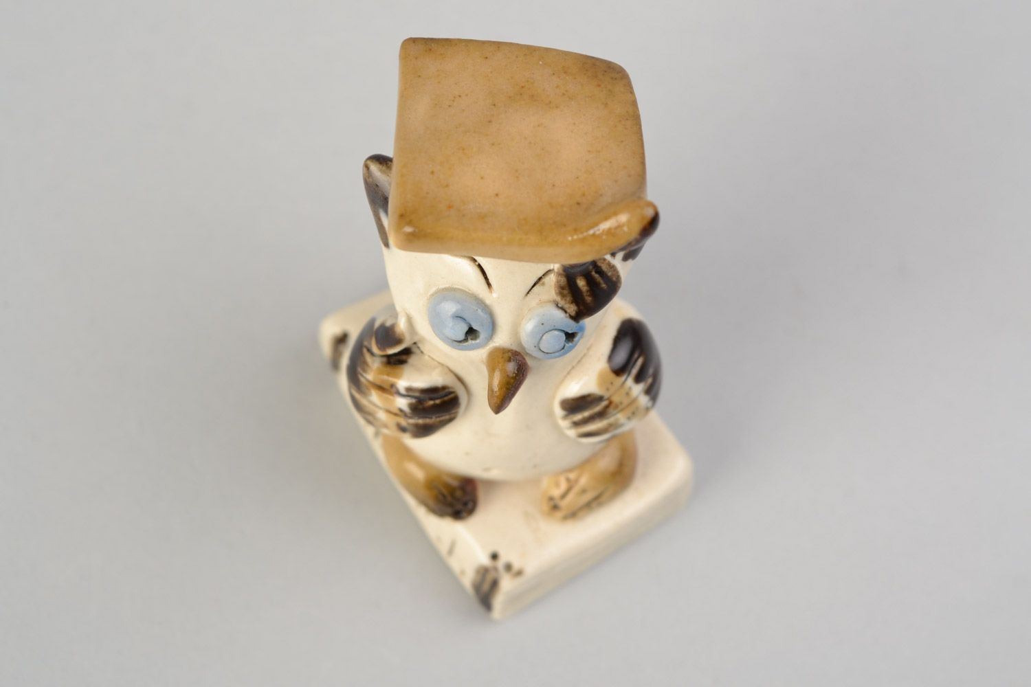 Handmade small cute ceramic figurine of owl in graduate cap painted with glaze photo 3