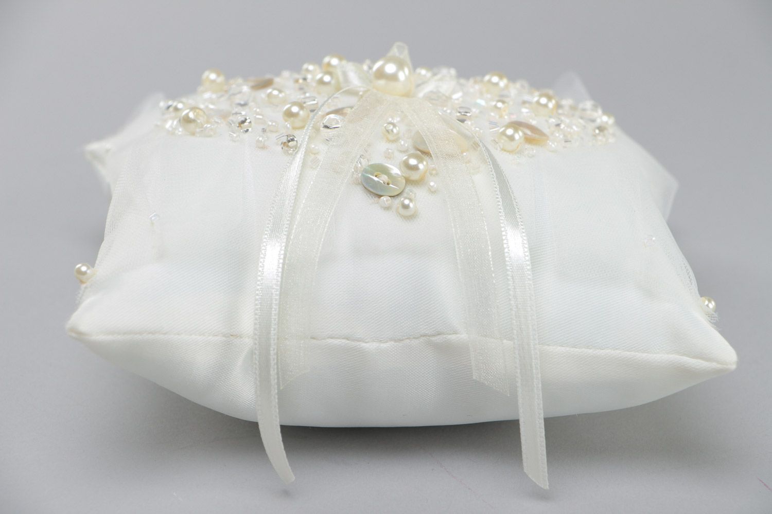 Handmade elegant wedding ring pillow sewn of satin fabric of ivory color photo 3