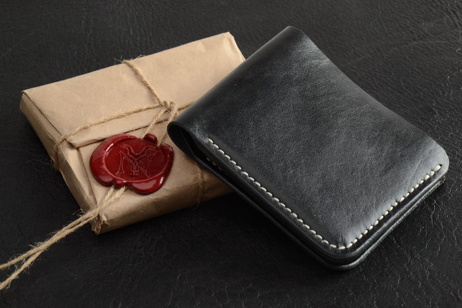 Homemade black leather men's wallet sewn with waxed thread with embossing photo 1