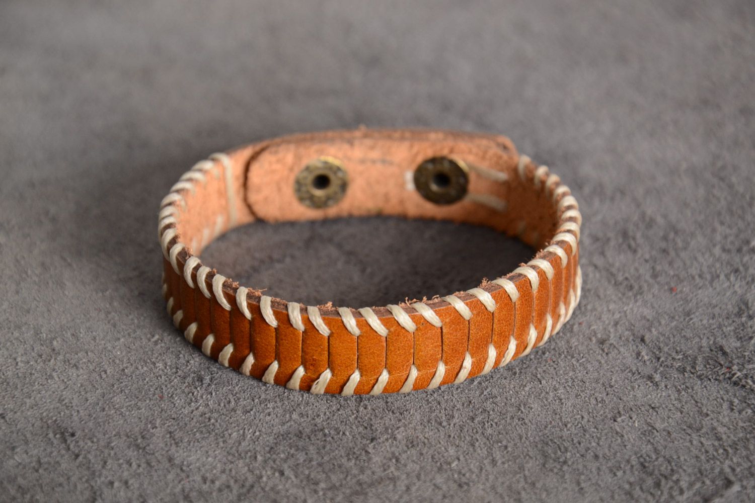 Thin handmade light brown genuine leather wrist bracelet with metal rivets photo 1