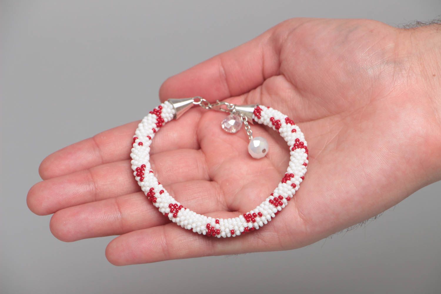 Handmade designer white and red beaded cord women's wrist bracelet with charms  photo 5