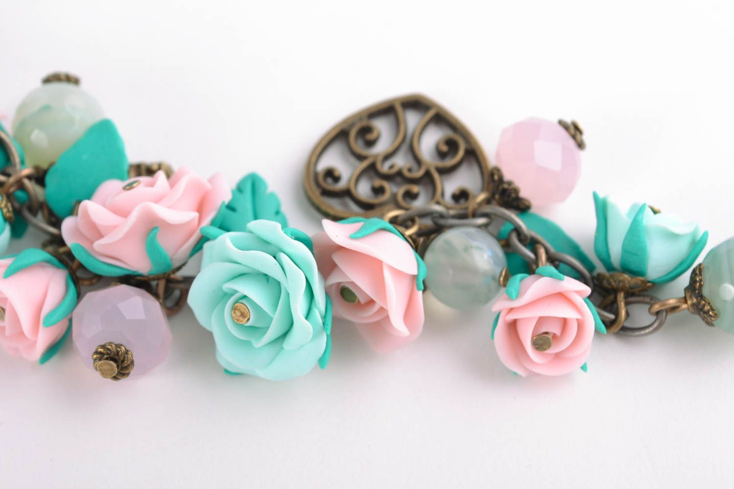 Charm bracelet with pink and turquoise roses and bronze charms photo 4