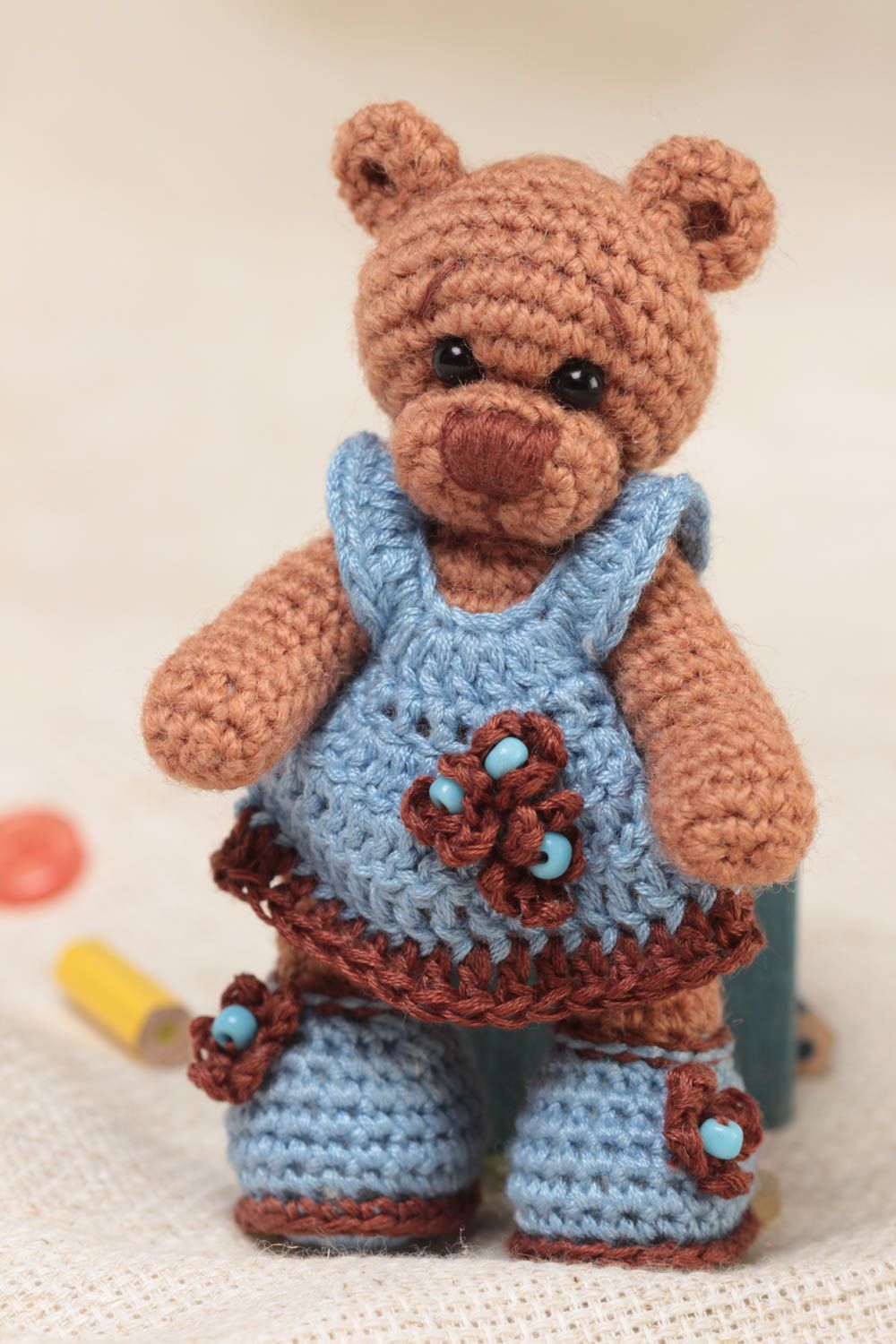 Handmade small crocheted soft toy brown bear girl in blue dress and shoes  photo 1