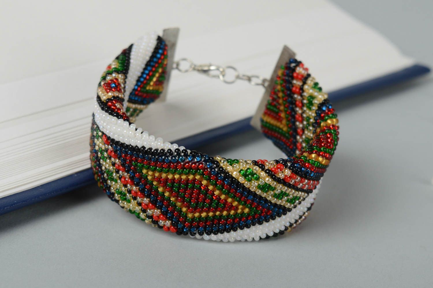 Delicate ethnic beaded bracelet in white, red, green colors for women photo 1