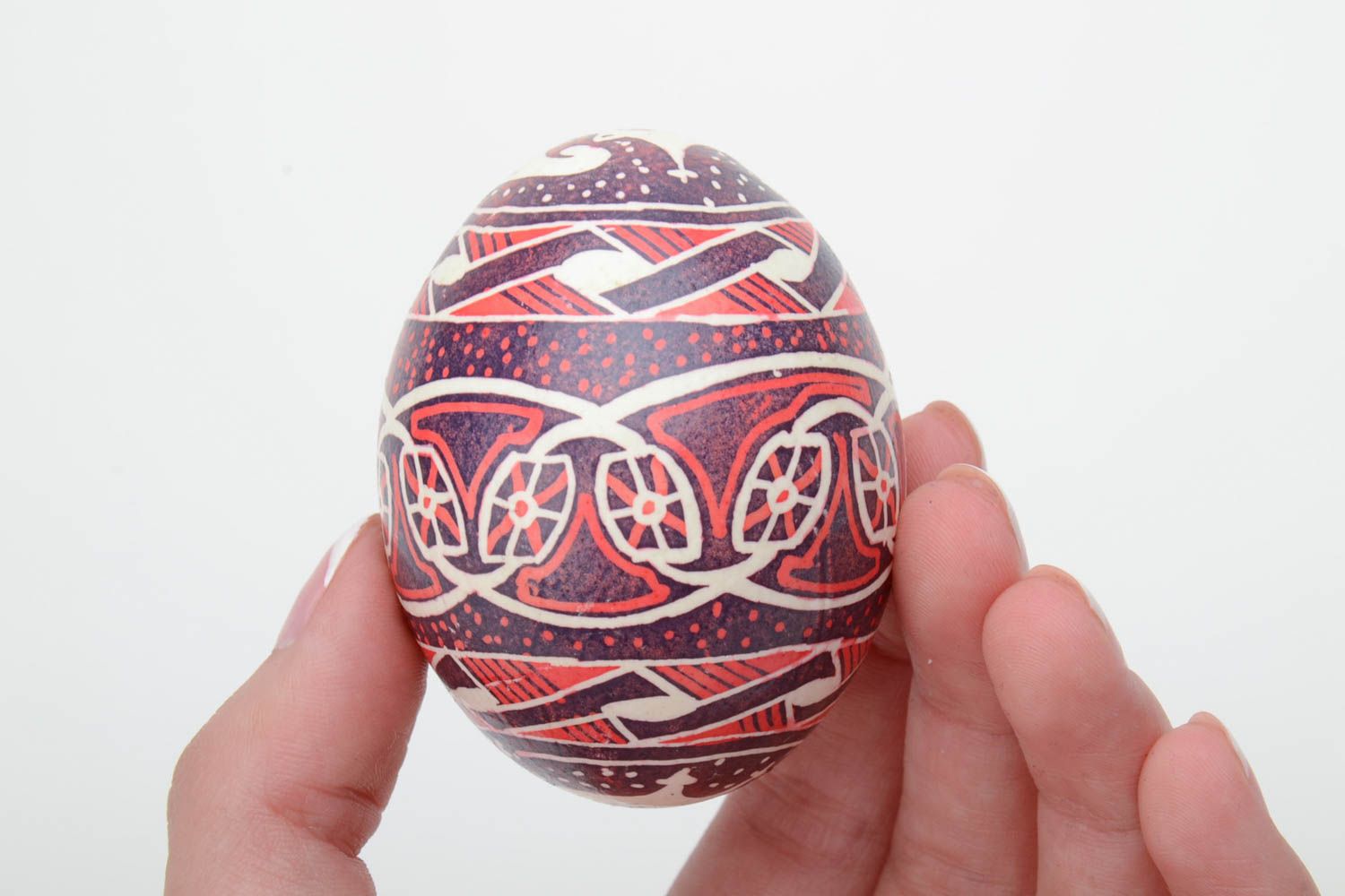 Homemade decorative ethnic painted Easter egg pysanka in red color palette photo 5