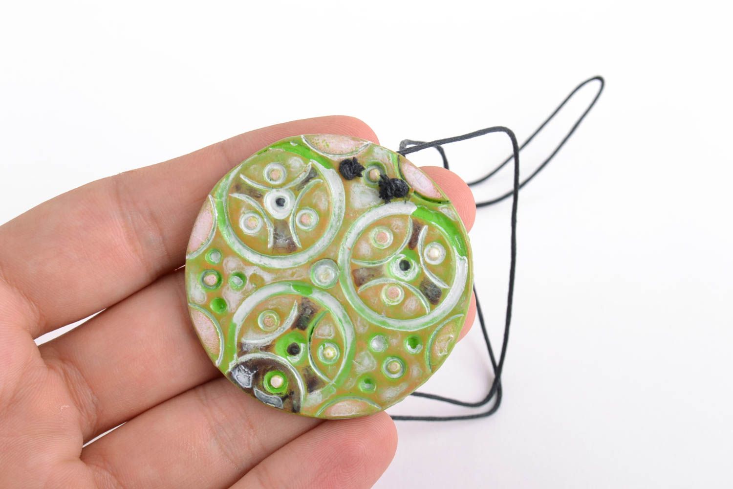 Handmade women's round ceramic pendant of bright green color with ornament photo 2