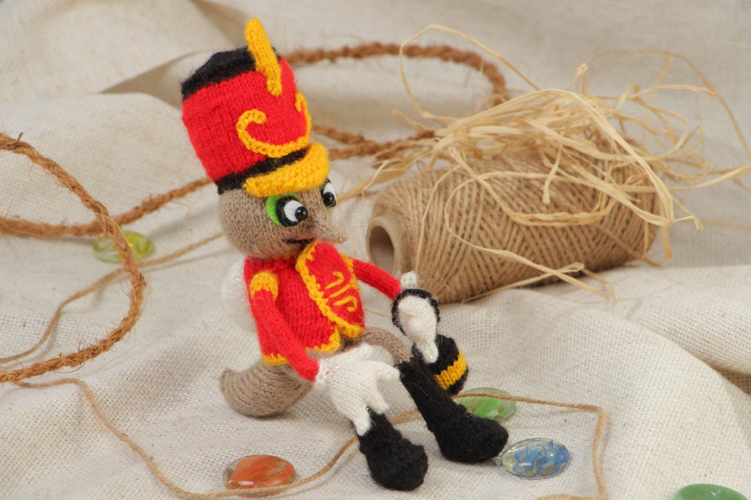 Handmade small soft knit toy in the shape of a mosquito in hussar uniform photo 1