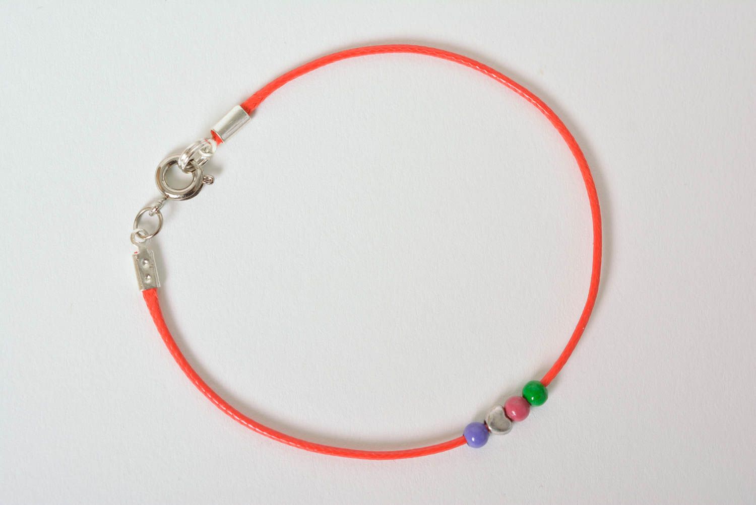 Handmade thin red bracelet cord with blue, green, blue, and silver beads photo 5
