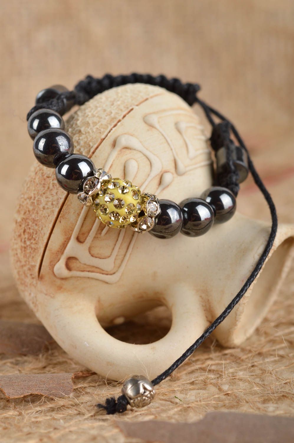 Handmade black beads strand bracelet on black cord with golden centerpiece for women photo 1