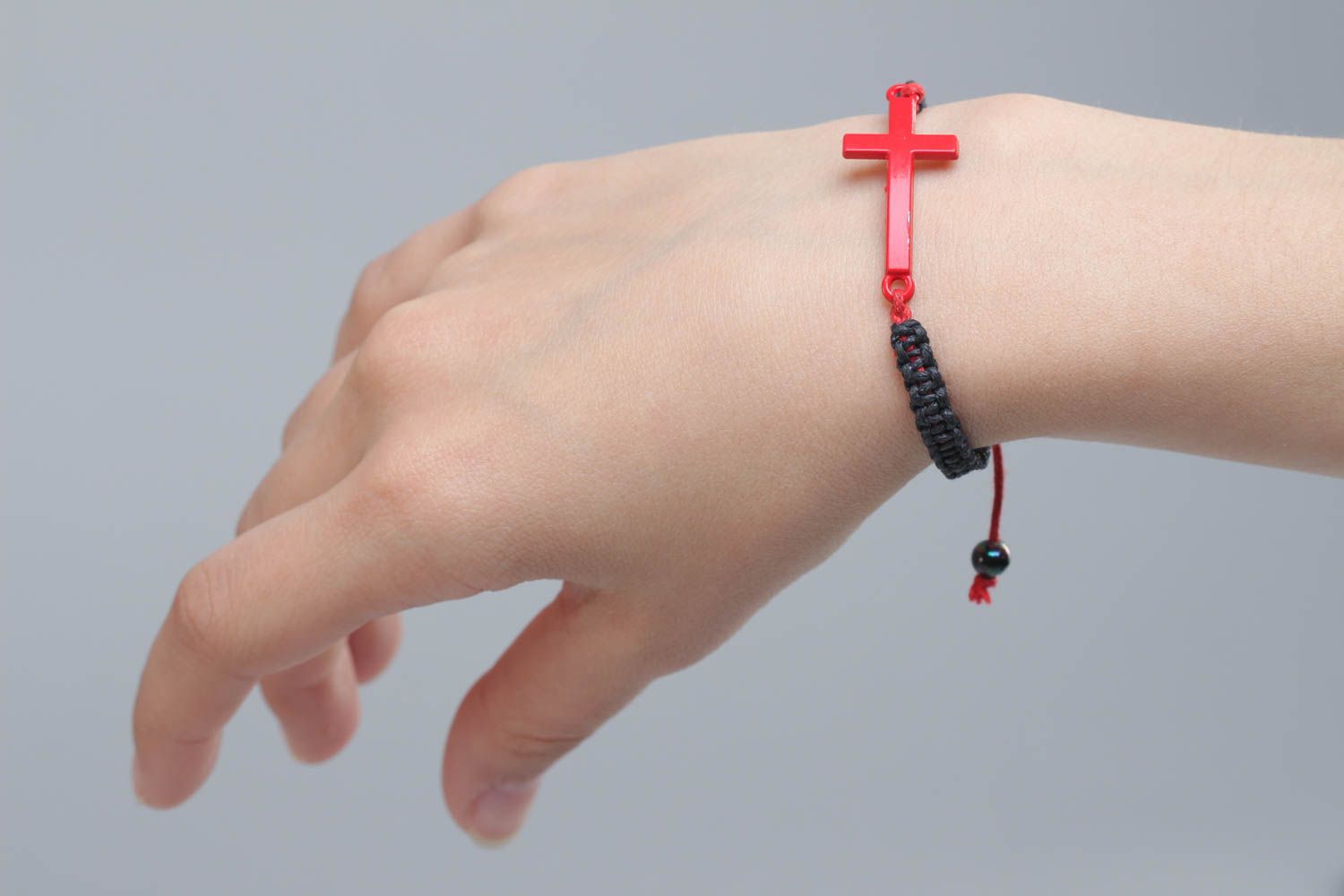 Unusual handmade black woven friendship bracelet with cross charm photo 4