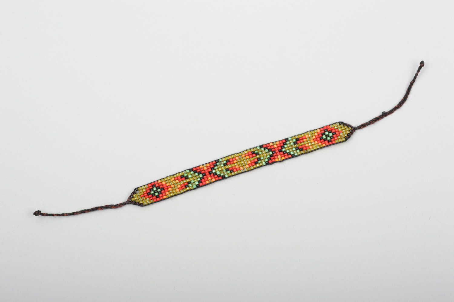 Handmade beaded strand bracelet with green, red, black beads for women photo 4