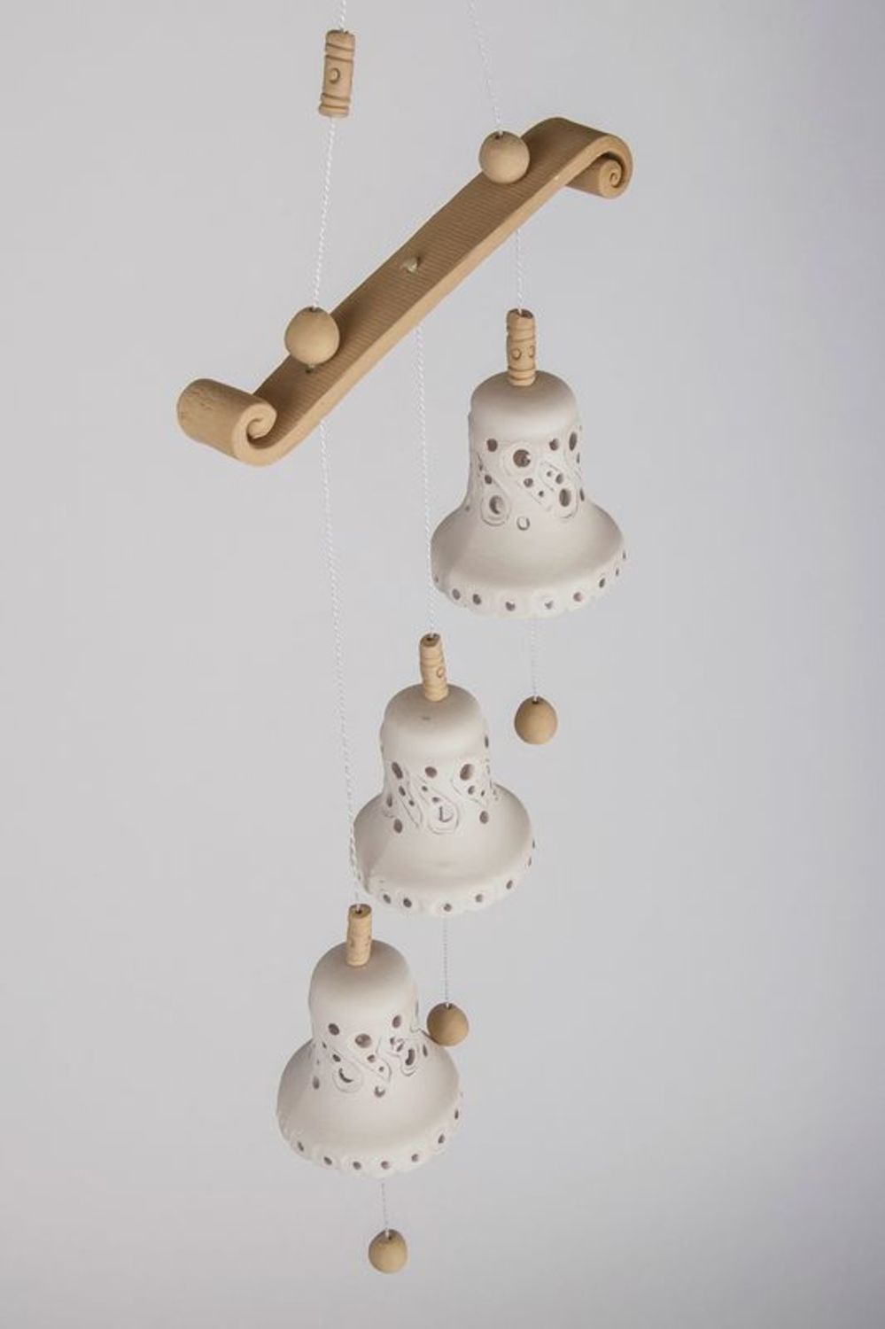 Souvenir bells made from white clay photo 3