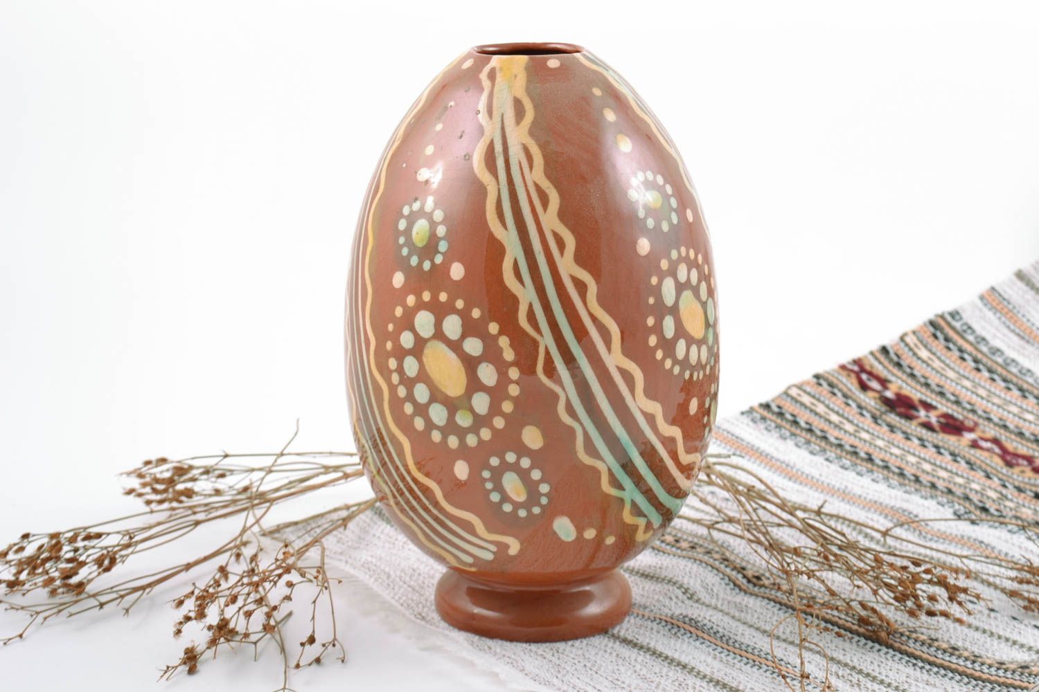 Handmade beautiful decorative ceramic flower vase in the shape of painted egg photo 1