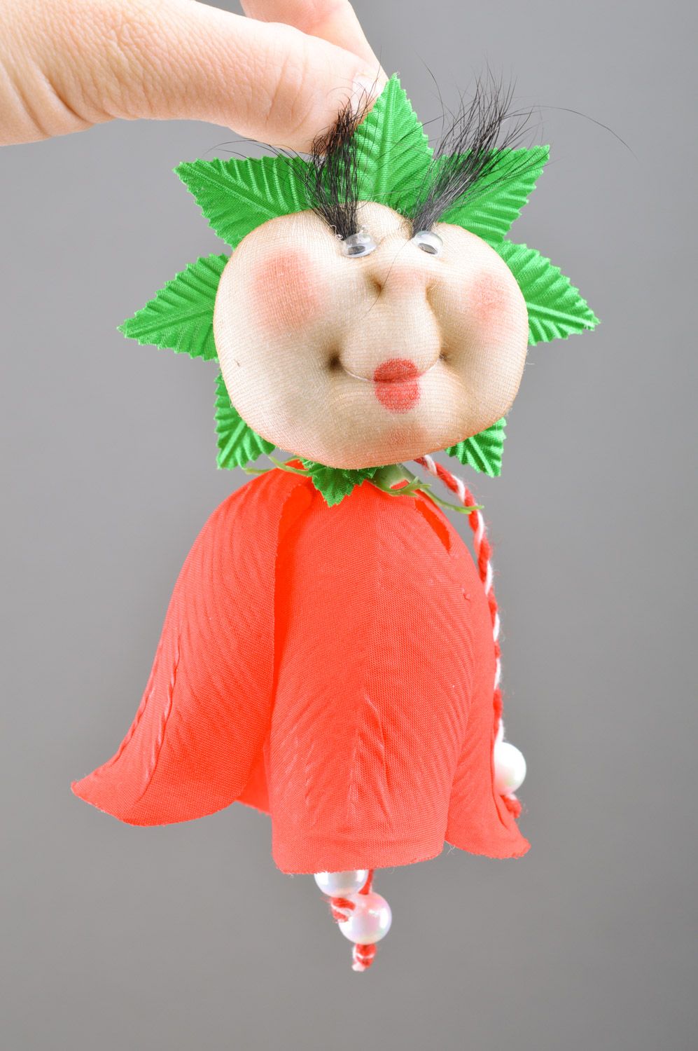 Unusual bell-shaped soft toy with long eye lashes sewn of colorful fabric  photo 1