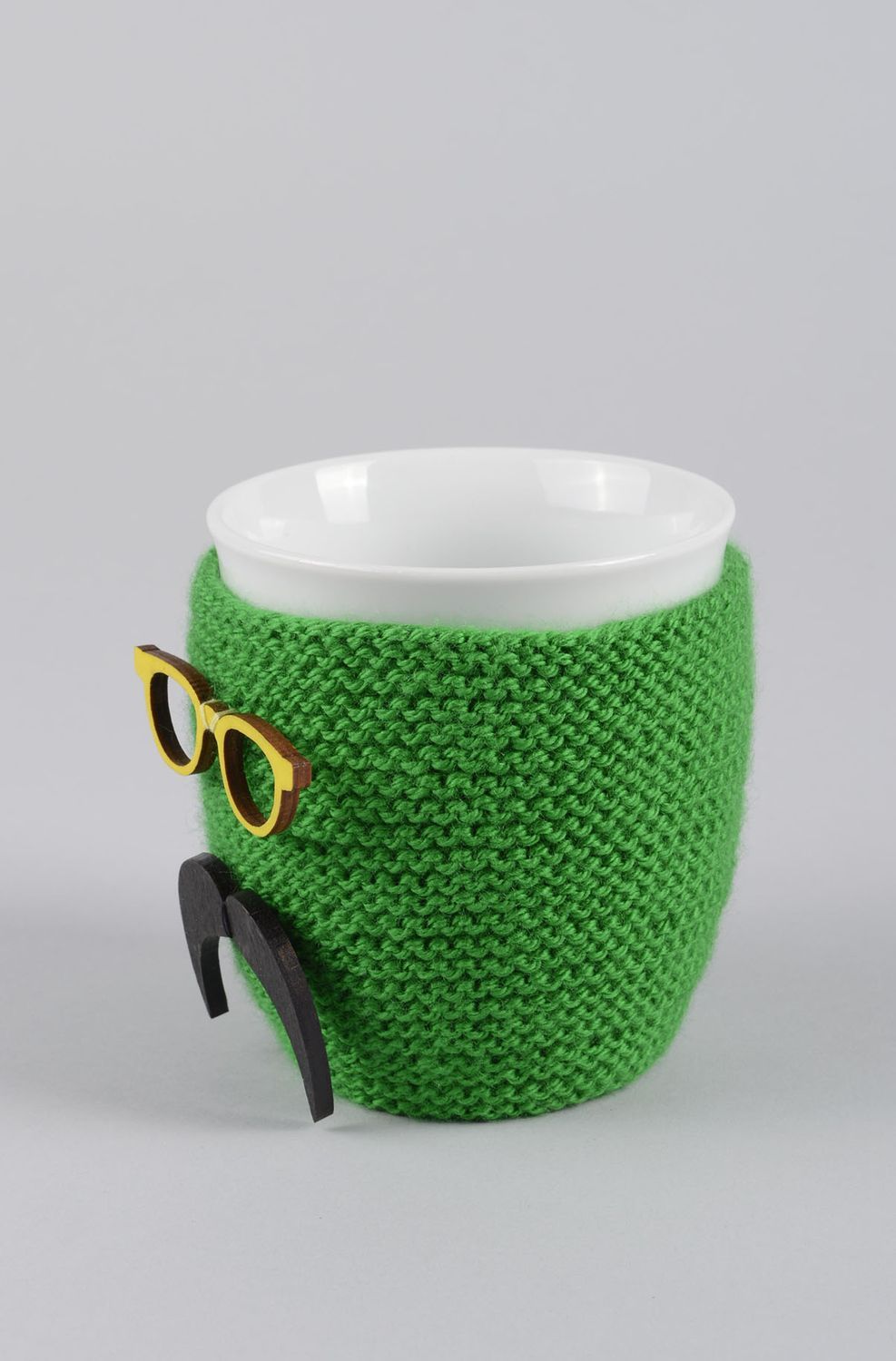 White ceramic porcelain teacup with handle and green man with mustache knitted cover photo 4