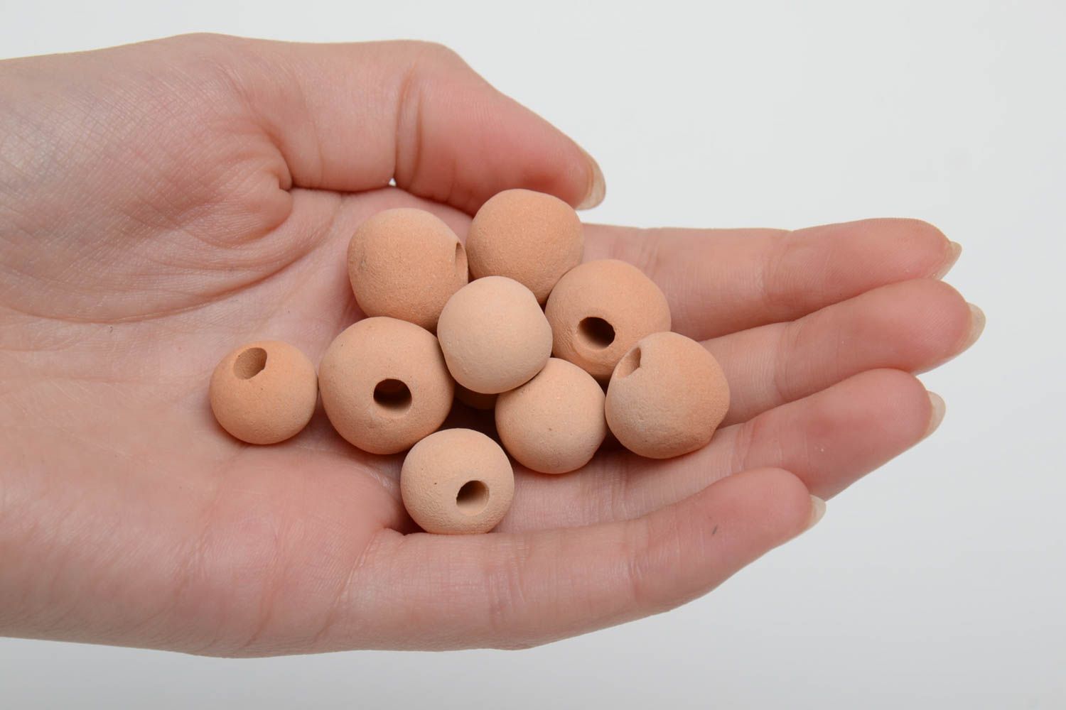 Set of 10 small handmade beige ceramic beads with smooth surface photo 5