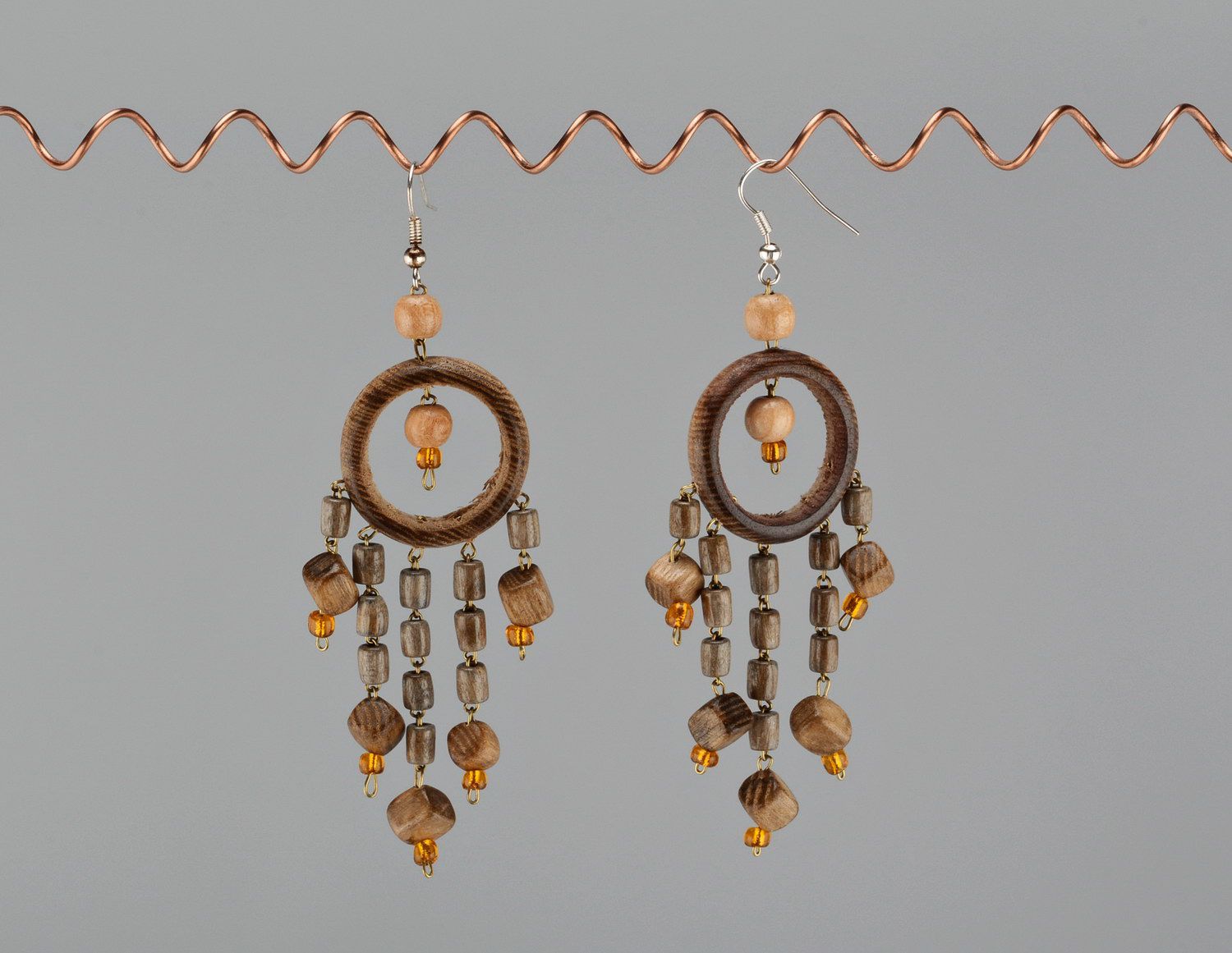 Decorative earrings made from wood with beads photo 3