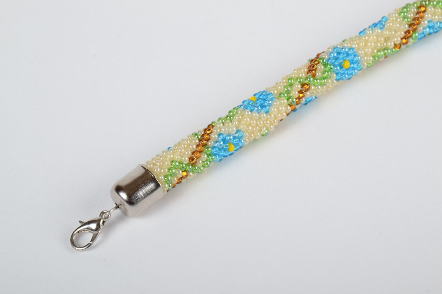 Bright beaded cord adjustable bracelet in ethnic style with floral ornament photo 3