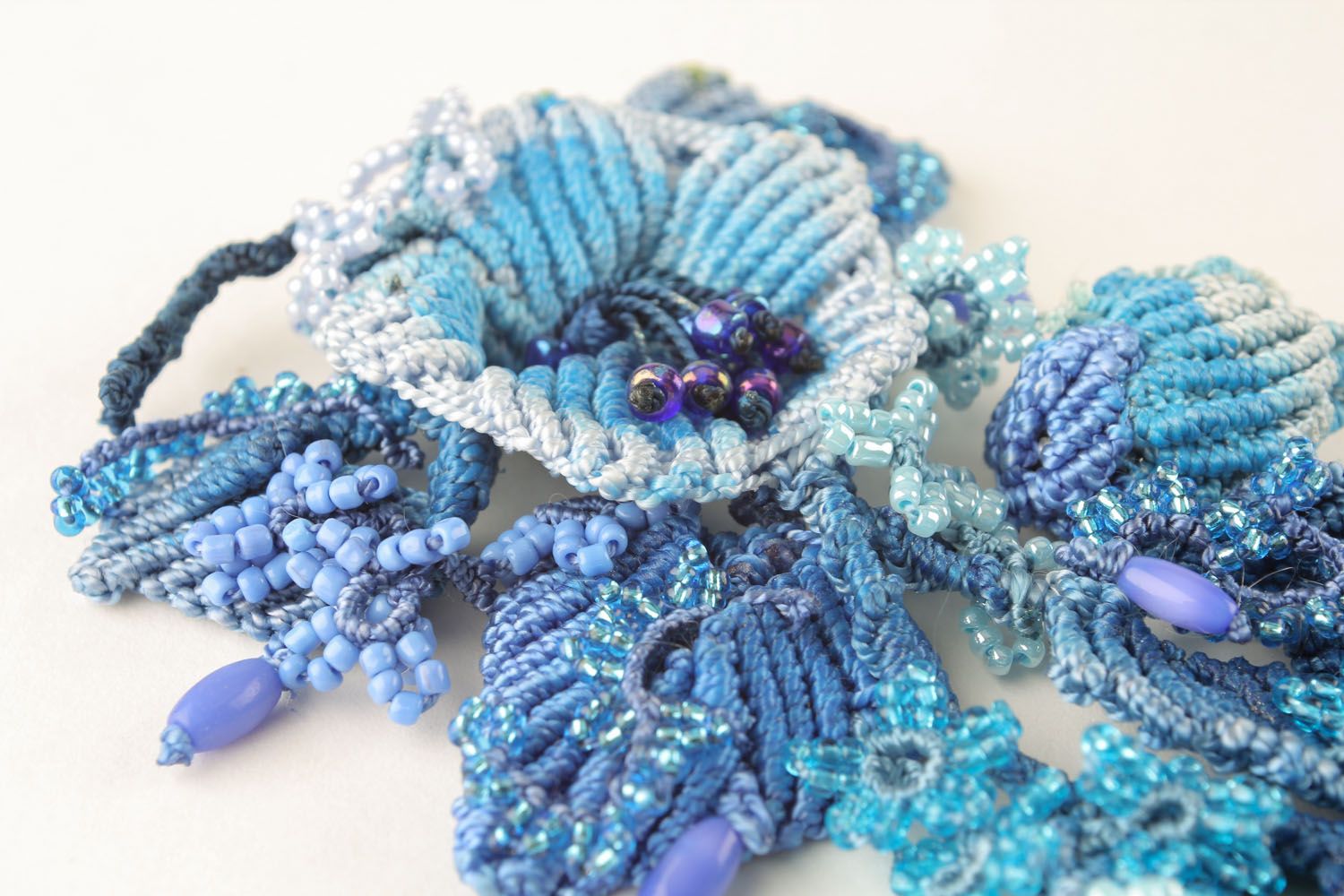 Blue brooch made of threads and beads photo 5