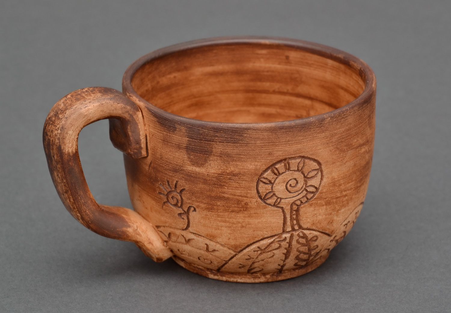 6 oz clay coffee cup with handle and cave drawings photo 1