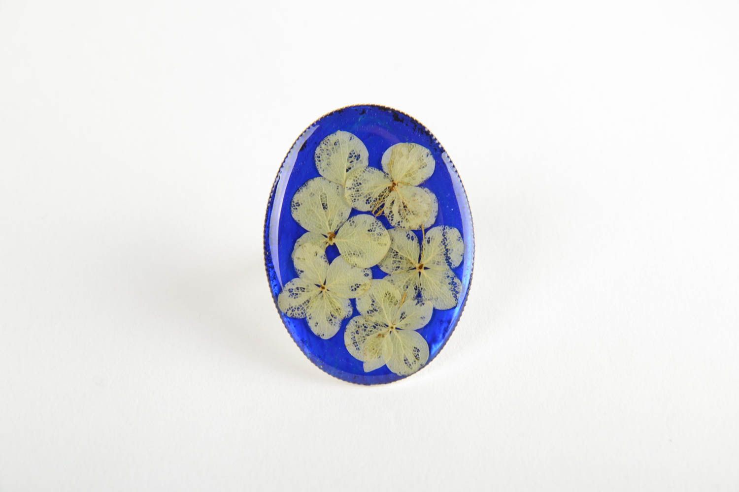 Handmade oval ring with dried flowers on bright blue basis in epoxy resin photo 3