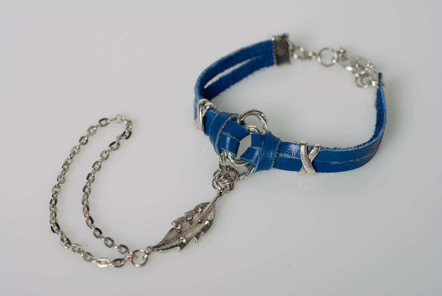 Unusual handmade genuine leather slave bracelet of blue color with metal charm photo 1