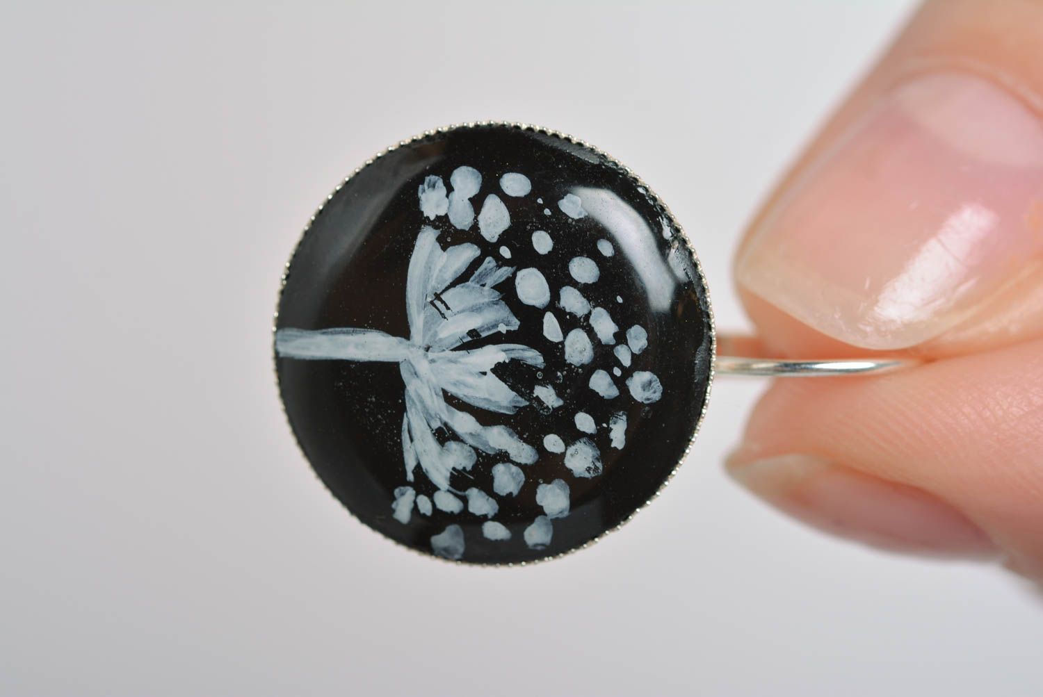 Round-shaped black handmade earrings made of epoxy resin with picture inside photo 3