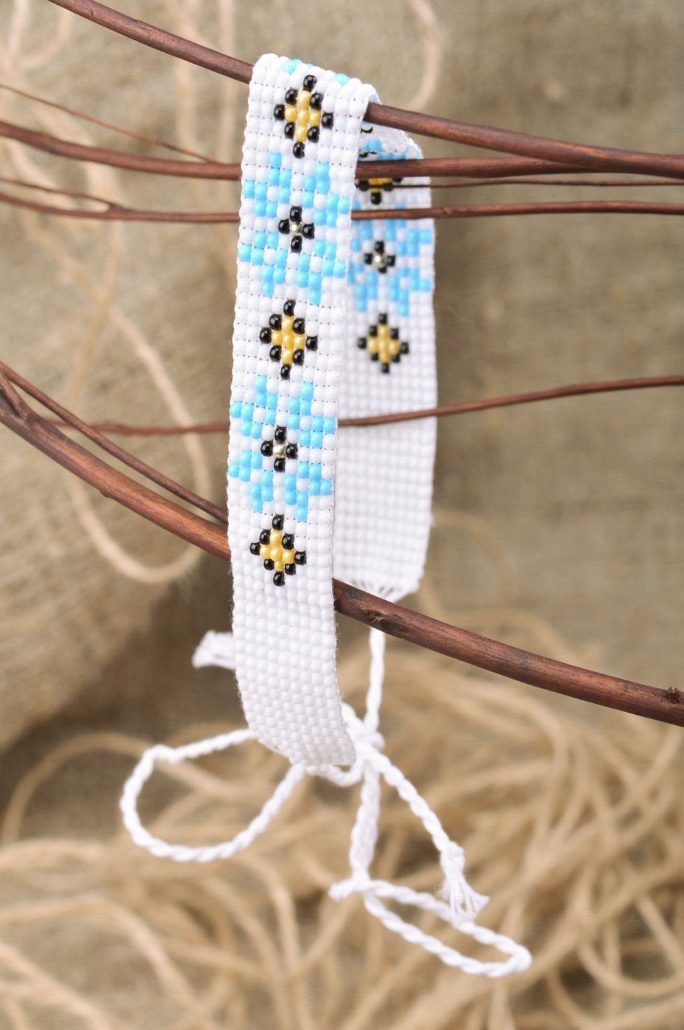 Beautiful women's handmade woven Czech bead necklace of white color with blue flowers photo 1