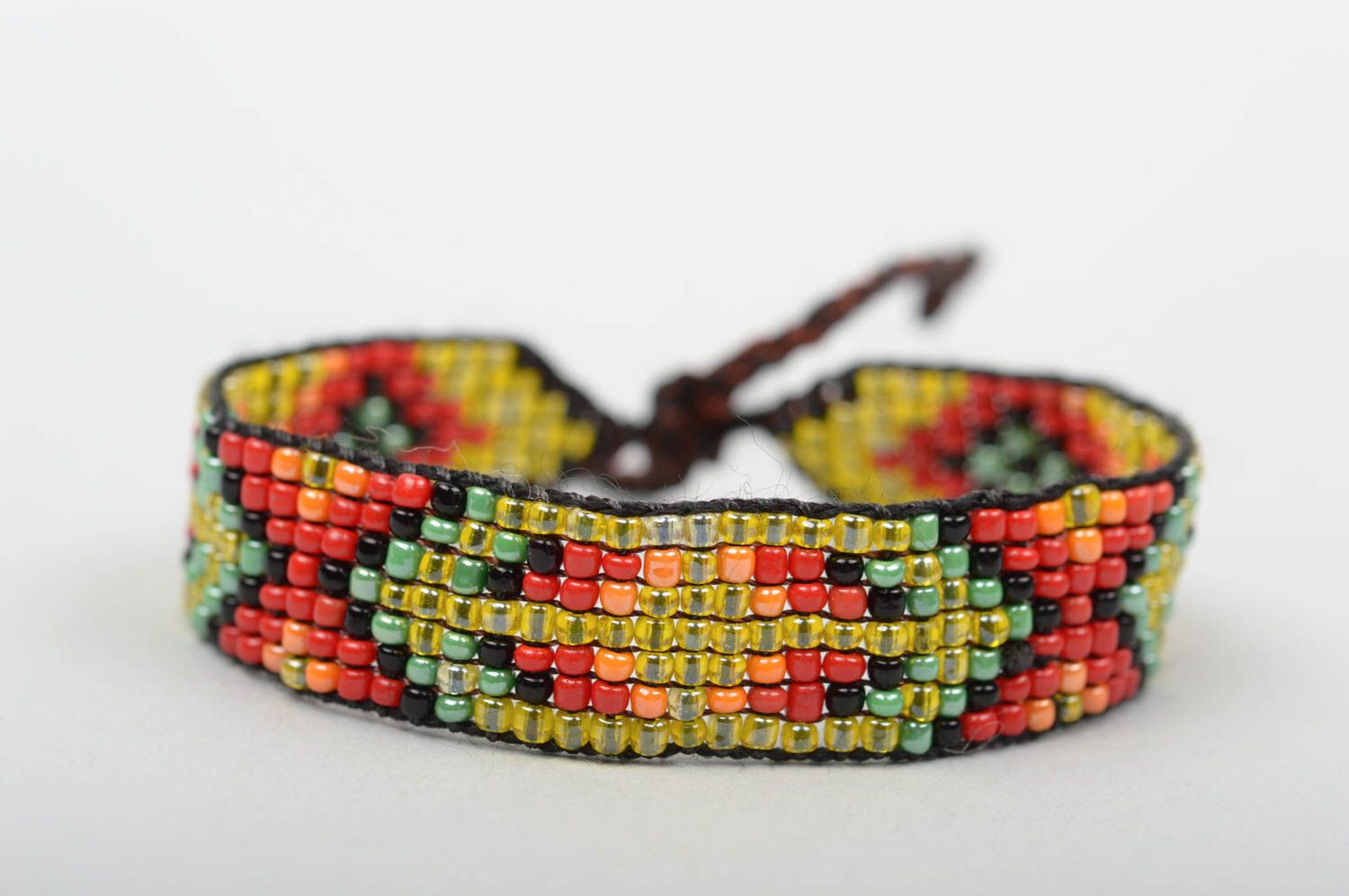 Handmade beaded strand bracelet with green, red, black beads for women photo 1