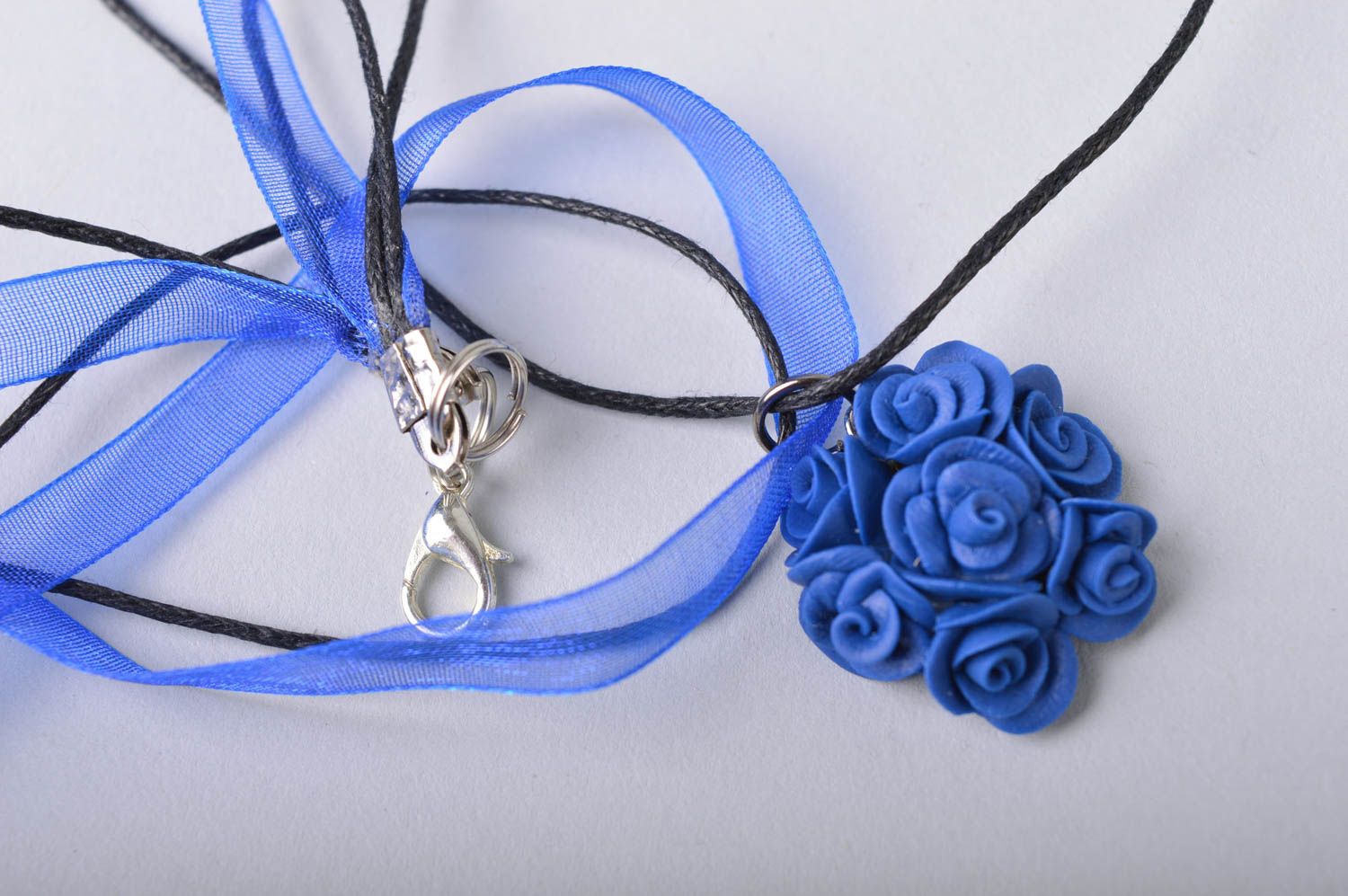 Handmade small floral deep blue cold porcelain pendant on ribbon and cord photo 4