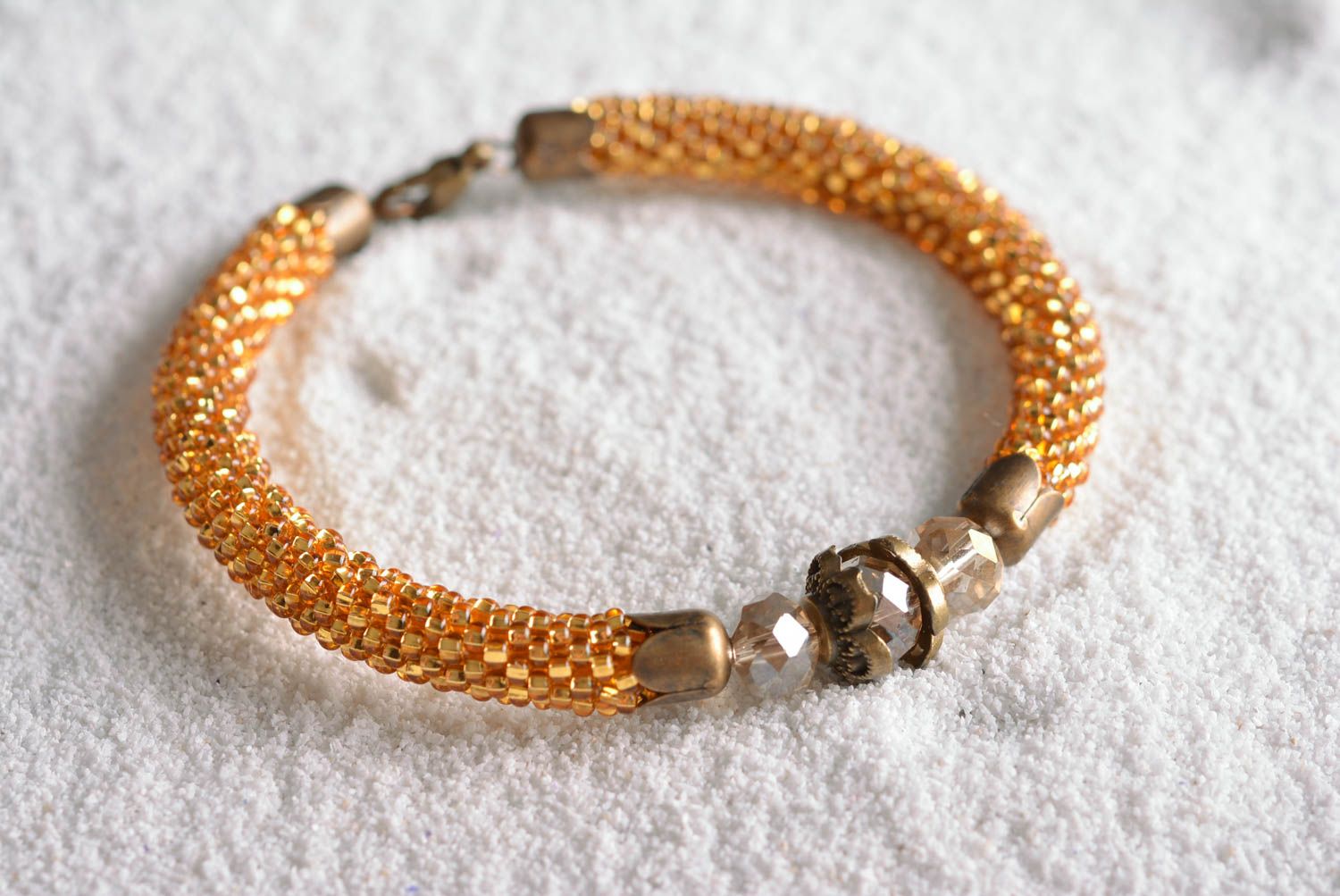Handmade gold color beads cord bracelet with centerpiece transparent bead photo 1