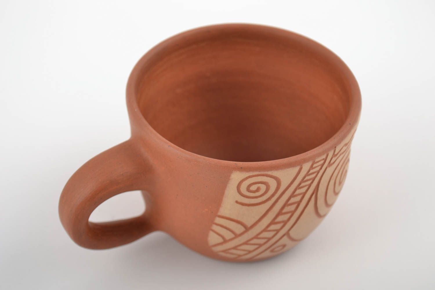 8 oz clay cup in terracotta and beige color with cave drawings photo 3