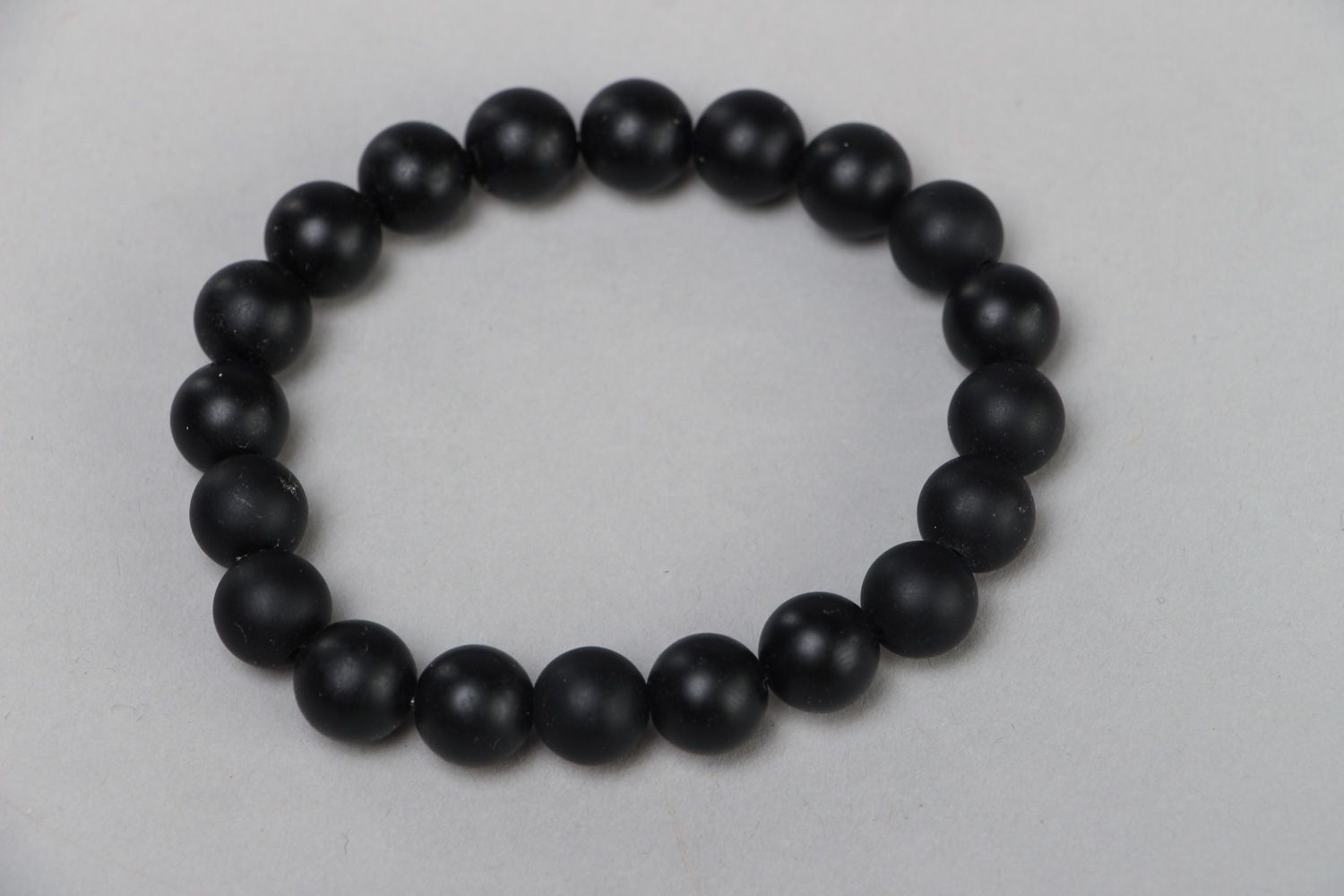Handmade wrist stretch bracelet with natural stone beads of black color photo 1