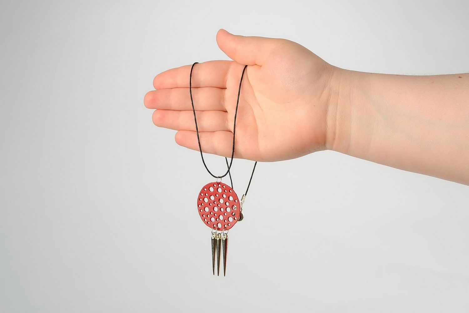 Pendant made of natural leather with studs photo 5