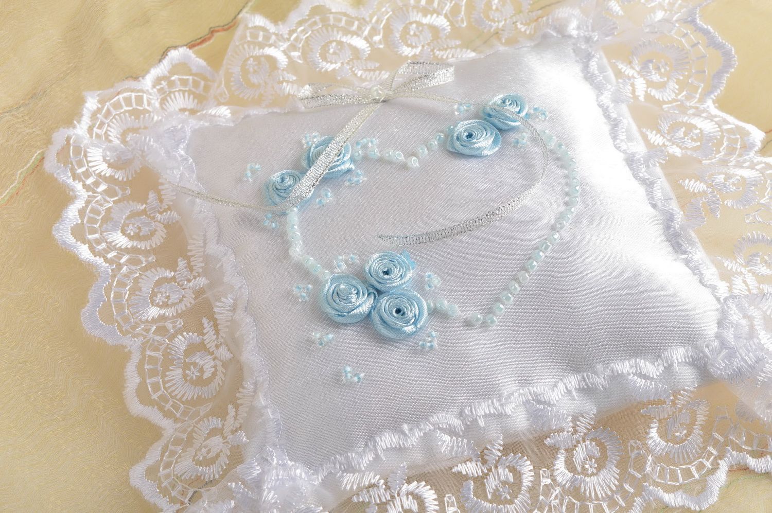 Beautiful designer handmade satin wedding ring pillow with lace and blue flowers photo 1