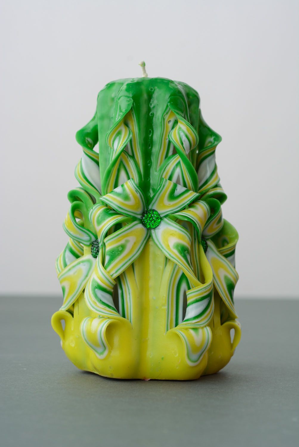 Green and yellow paraffin candle photo 5