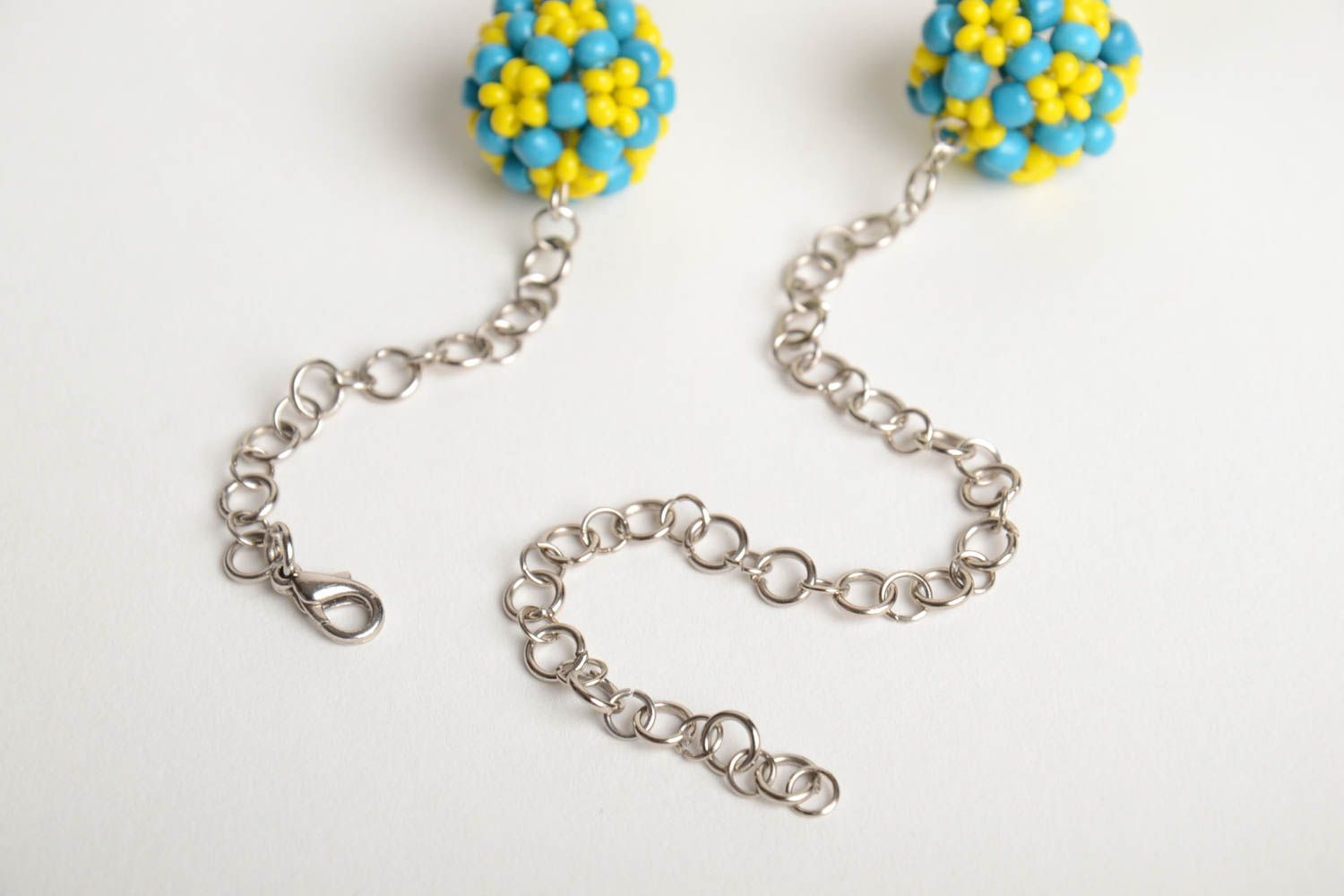 Handmade designer necklace with metal chain and bead woven blue and yellow balls photo 5