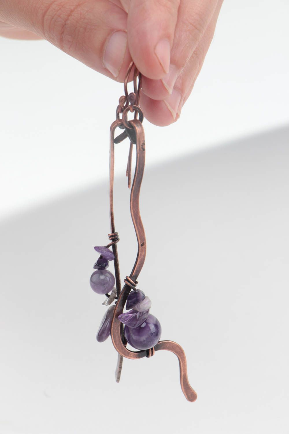 Handmade long curved dangling earrings forged of copper with amethyst beads photo 5