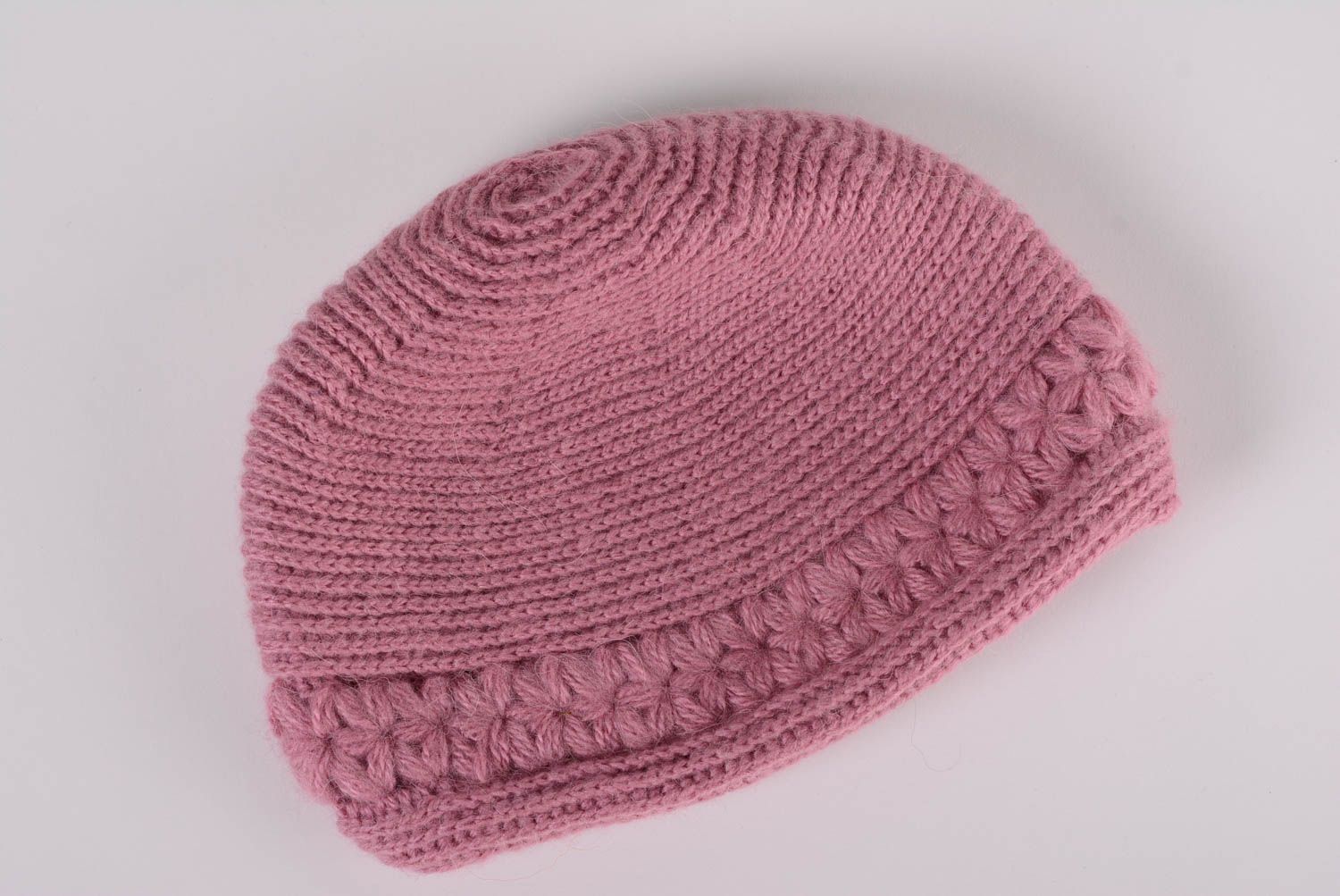 Handmade warm women's hat knitted of woolen threads of dark pink color photo 2