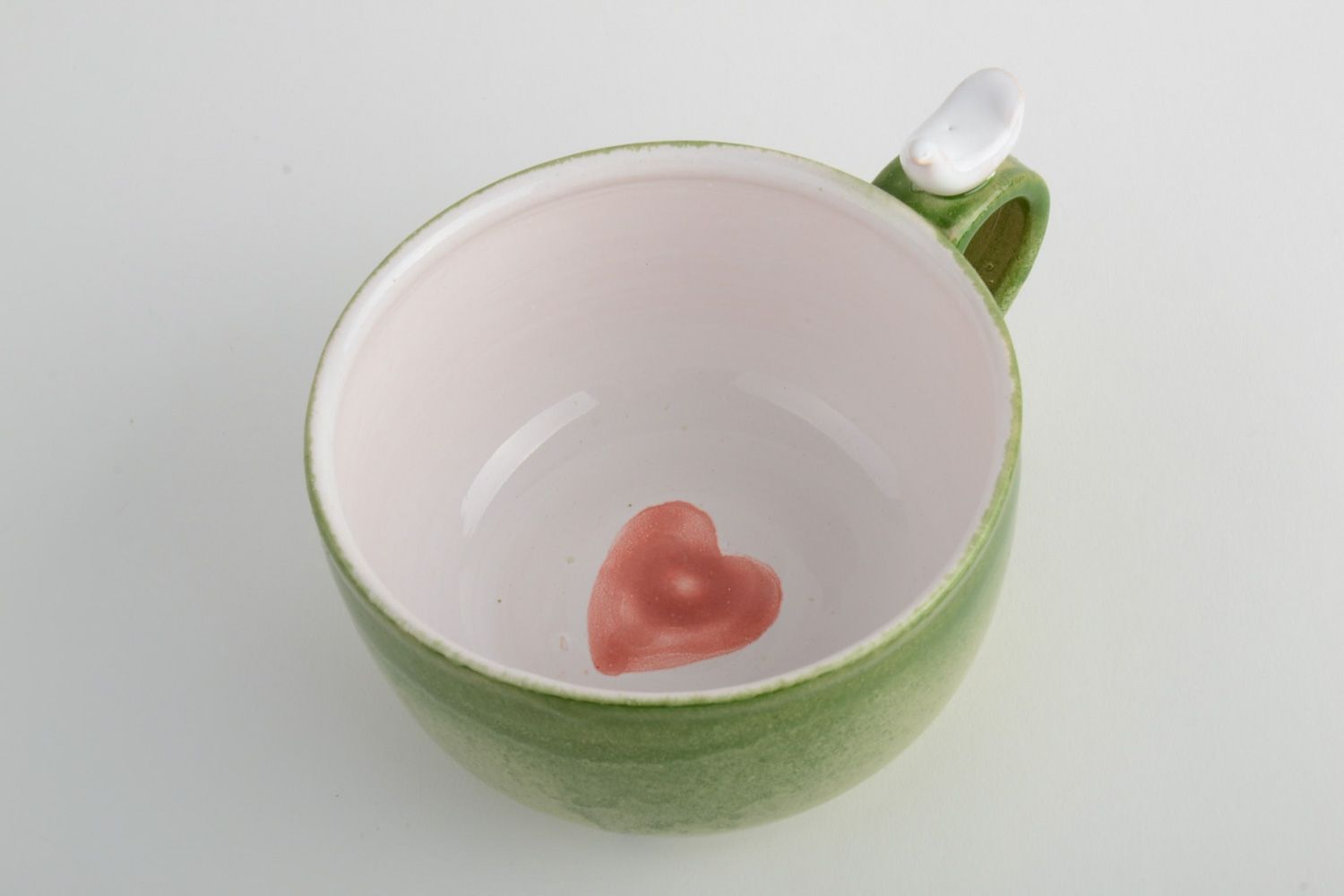 Light green porcelain drinking cup with handle and red heart on the bottom photo 4