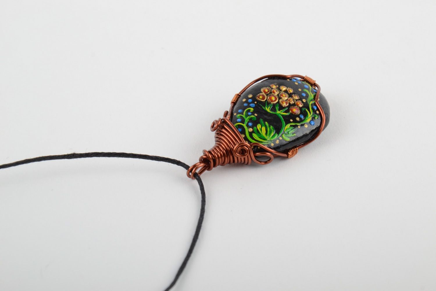 Unusual handmade plastic pendant woven over with copper wire and equipped with cord photo 5