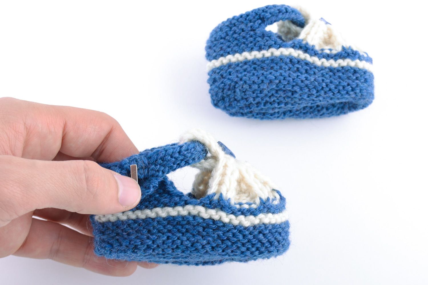 Beautiful small handmade warm baby bootees knitted of natural wool photo 2