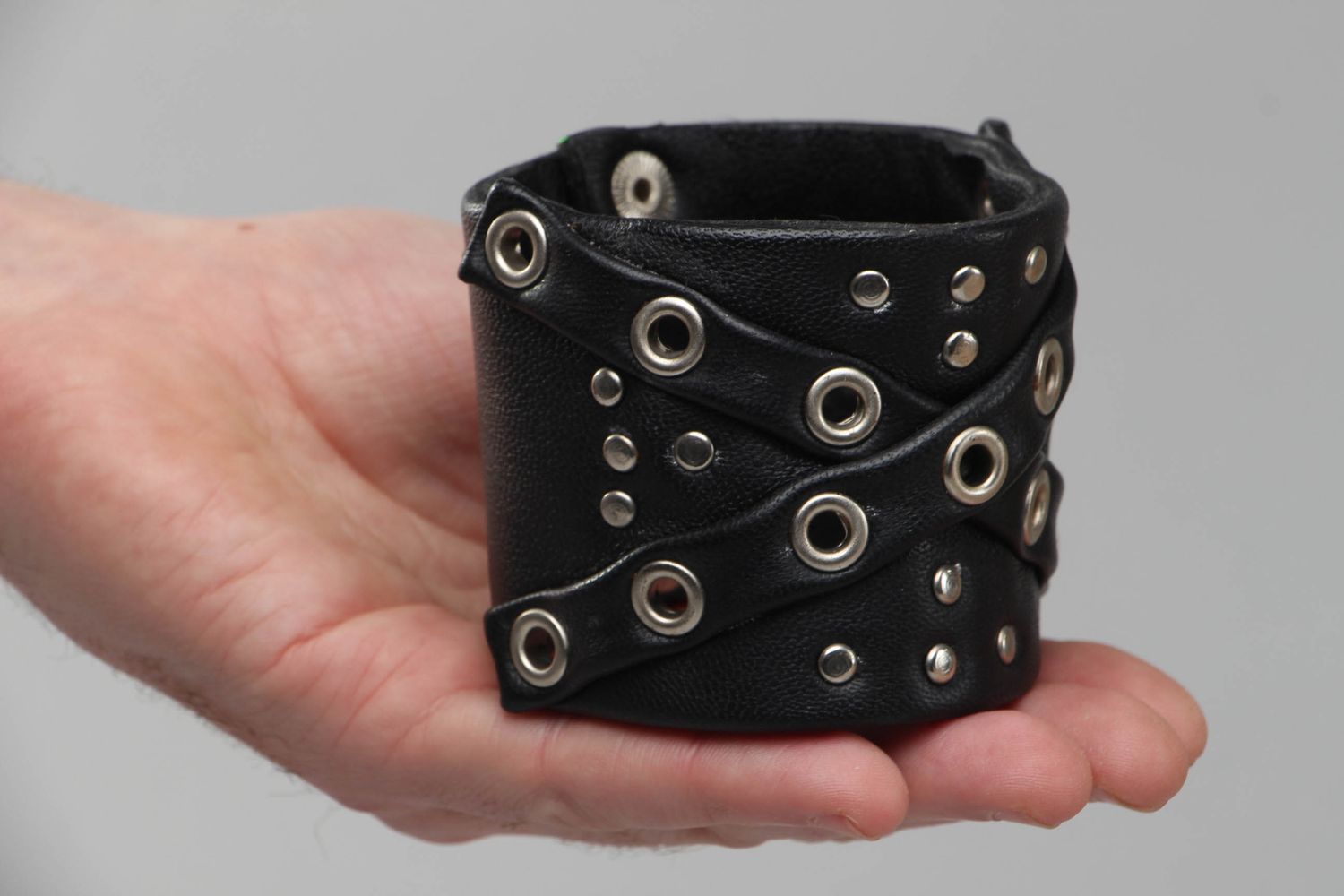 Wide leather bracelet with metal inserts photo 4