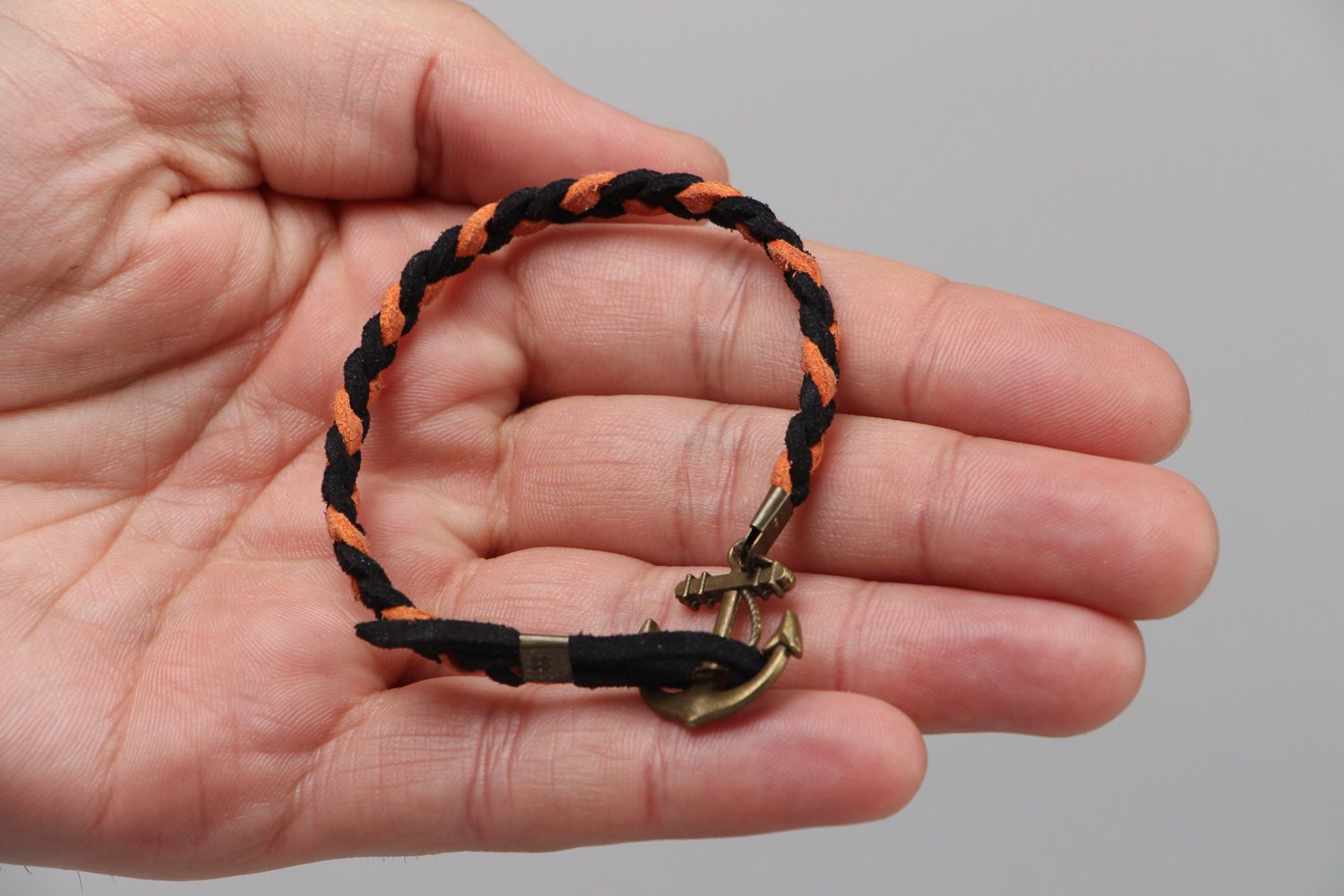 Handmade thin friendship bracelet woven of faux suede with anchor shaped charm photo 3